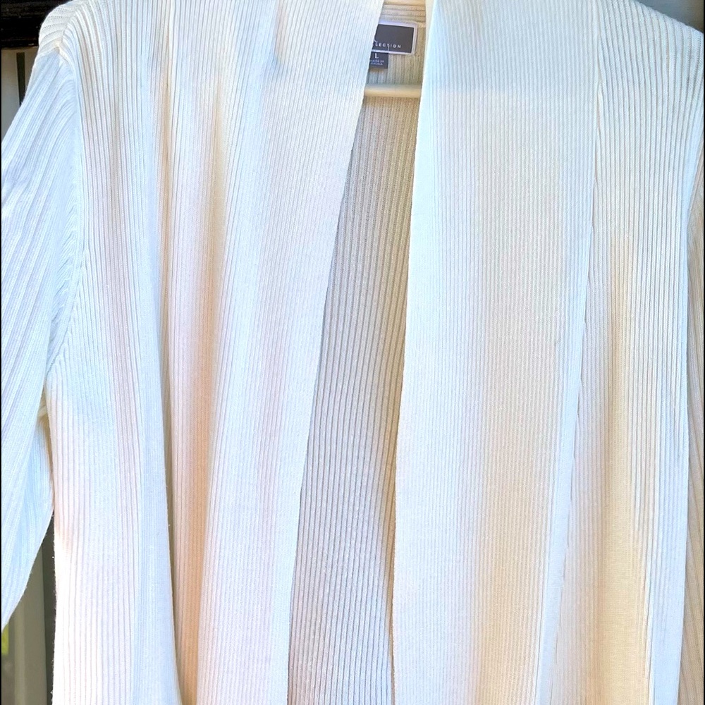 Soft, cream color cardigan. Knee length cardigan.